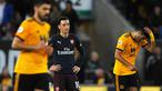 Megaintang Arsenal, Mesut Ozil bereaksi setelah pemain Wolverhampton Wanderers, Matt Doherty mencetak gol pada laga lanjutan Liga Inggris 2018-2019 di Stadion Molineux, Rabu (24/4). Arsenal harus tumbang dengan skor 1-3 kala bertandang ke markas Wolverhampton Wanderers. (AP Photo/Rui Vieira)