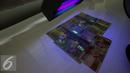 Gambar uang kertas rupiah disinari lampu ultraviolet di kantor Peruri, Karawang, Jawa Barat, Rabu (18/1). Rupiah memiliki sistem pengamanan tiga level dan menjadi mata uang yang pengamanannya sangat kompleks. (Liputan6.com/Faizal Fanani)