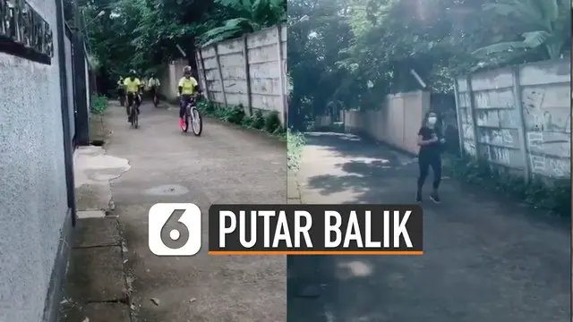 Rombongan pesepeda dan seorang yang jogging itu akhirnya putar balik setelah tak menghiraukan peringatan dari perekam video.