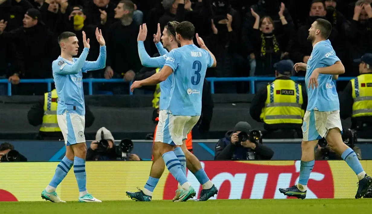 Manchester City jadi tim pertama yang lolos ke babak 16 besar Liga Champions usai menang 3-0 atas Young Boys. (AP Photo/Dave Thompson)