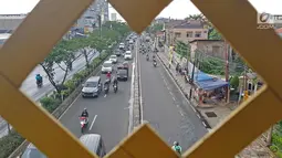 Sejumlah kendaraan melintas di kawasan Depok, Jawa Barat, Senin (9/4). Pemerintah Jawa Barat merencanakan mencoba jalan berbayar dengan metode ERP pada 2019 di sejumlah ruas jalan Margonda, Kota Depok. (Liputan6.com/Herman Zakharia)