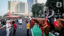 Suasana CFD di kawasan Jalan Sudirman-MH Thamrin terpantau ramai hari ini. Warga datang untuk berolahraga sekaligus refreshing. (Liputan6.com/Faizal Fanani)