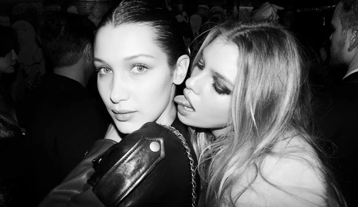 Pesta tersebut dilaksanakan di kelab London. Bella dan Stella terlihat bermesraan di pojok kelab. (vogue.it)