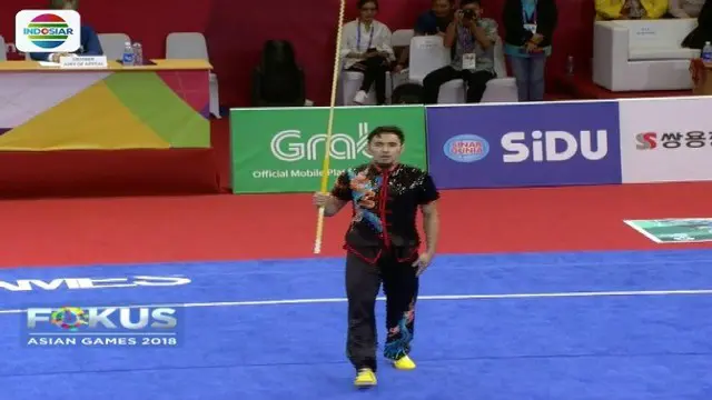 Achmad Hulaefi, atlet wushu putra Indonesia yang tampil dengan tenang raih medali perunggu.