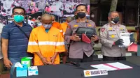 Polresta Malang Kota menangkap pelaku peredaran narkoba jenis ganja sindikat lapas beserta barang bukti 1 kilogramganja kering (Liputan6.com/Zainul Arifin)