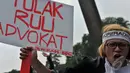 Para pengacara yang tergabung dalam Perhimpunan Advokat Indonesia (Peradi) melakukan aksi, Jakarta (11/9/2014) (Liputan6.com/Johan Tallo)