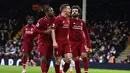 Selebrasi gol James Milner pada laga lanjutan Premier League yang berlangsung di Stadion Craven Cottage, London, Minggu (17/3). Liverpool menang 2-1 atas Fulham. (AFP/Glyn Kirk)