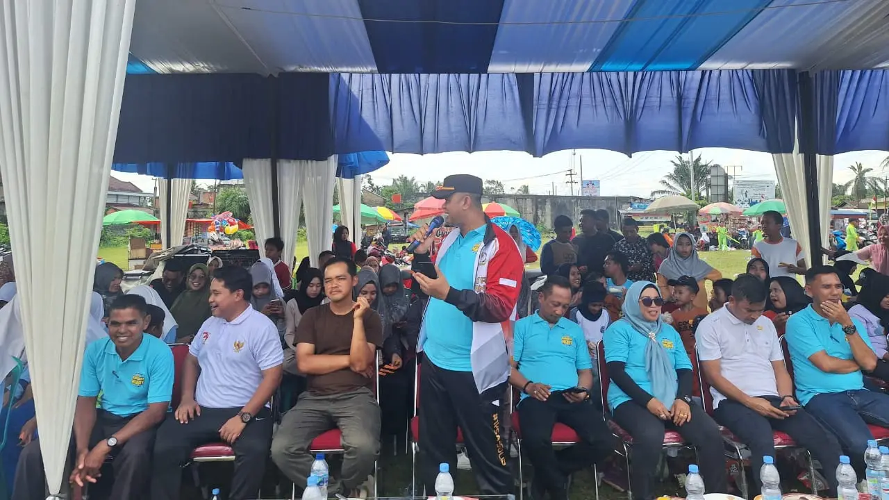 Personel Polres Rokan Hulu mengajak ratusan warga waspadai peredaran uang palsu dan judi online serta tidak golput saat Pilkada 2024.