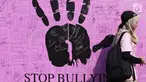 Warga melintas di depan banner tanda tangan dukungan Stop Bullying saat Car Free Day di Bundaran HI, Jakarta, Minggu (13/5). Bullying adalah tindakan mencoba untuk menyakiti atau mengontrol orang lain dengan kekerasan. (Liputan6.com/Helmi Fithriansyah)