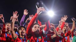Timnas Maroko tampil mengejutkan sekaligus mencetak sejarah baru dengan meraih gelar juara Piala Dunia U20 2025 usai mengalahkan Argentina 2-0. (Javier TORRES/AFP)