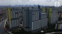 Foto aerial suasana Rumah Sakit Darurat Penanganan COVID-19 Wisma Atlet Kemayoran, di Jakarta, Selasa (2/2/2021). Pemerintah melalui Kemenkes mengizinkan semua rumah sakit jika memiliki fasilitas penanganan COVID-19 untuk memberikan layanan ke pasien COVID-19. (merdeka.com/Imam Buhori)