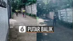 Rombongan pesepeda dan seorang yang jogging itu akhirnya putar balik setelah tak menghiraukan peringatan dari perekam video.