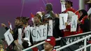 Sekelompok suporter Indonesia saat mendukung Timnas Indonesia menghadapi Vietnam pada laga kedua Grup D Piala Asia 2023 di Abdullah Bin Khalifa Stadium, Doha, Qatar, Jumat (19/1/2024). (AFP/Karim Jaafar)