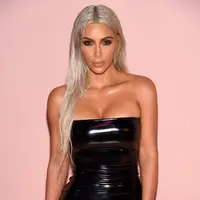 Melansir Ace Showbiz, Minggu (10/9/2017), Kim yang menghindari adanya hujatan pada dirinya mengenai jasa ibu pengganti yang digunakannya pun akhirnya buka suara. (AFP/Dimitrios Kambouris)