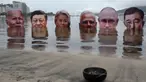 Dari kiri ke kanan, potret raksasa Presiden AS Joe Biden, Presiden Tiongkok Xi Jinping, Presiden Komisi Eropa Ursula von der Leyen, Perdana Menteri India Narendra Modi, Presiden Rusia Vladimir Putin, dan Perdana Menteri Jepang Shigeru Ishiba ditenggelamkan menjelang pelaksanaan Konferensi Tingkat Tinggi (KTT) G20 di Rio de Janeiro, Brasil, pada 16 November 2024. (Pablo PORCIUNCULA/AFP)