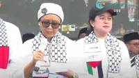 Menlu Retno Marsudi membacakan puisi "Palestina Saudaraku" dalam aksi Bela Palestina di Monas, Minggu, 5 November 2023. (Foto: Tangkapan layar Youtube/@WahdahTV)