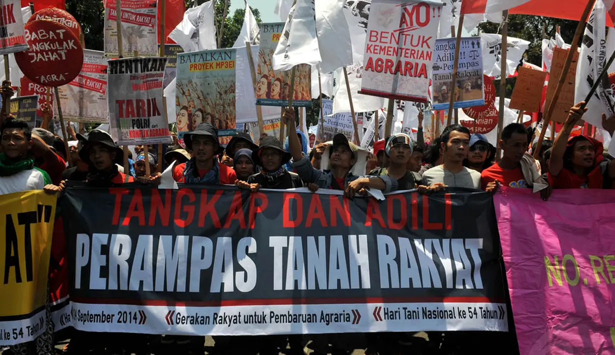 Memperingati Hari Tani Nasional, para petani menggelar unjuk rasa di Jakarta, (24/9/14). (Liputan6.com/Johan Tallo)