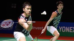 Dalam laga yang digelar di International Convention Center, Nusa Dua, Bali, Kevin Sanjaya Sukamuljo/Marcus Fernaldi Gideon harus bermain tiga game sebelum mengalahkan Choi Sol-gyu/Kim Won-ho dalam waktu tepat 1 jam. (Dok. PBSI)