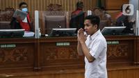 Terdakwa Richard Eliezer Pudihang Lumiu usai menjalani sidang dengan agenda pembacaan tuntutan oleh Jaksa Penuntut Umum dalam kasus pembunuhan Brigadir Yosua Hutabarat di Pengadilan Negeri Jakarta Selatan, Rabu (18/1/2023). Richard Eliezer Pudihang Lumiu di Tuntut 12 Tahun Penjara. (Liputan6.com/Johan Tallo)