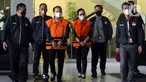 Bupati Kabupaten Kapuas periode 2013-2018 dan 2018-2023, Ben Brahim S. Bahat (ketiga kiri) bersama istrinya Ary Egahni yang saat ini menjabat sebagai Anggota DPR RI berjalan menuju ruang konferensi penetapan dan penahanan di Gedung Merah Putih Komisi Pemberantasan Korupsi (KPK), Jakarta, Selasa (28/3/2023). (Liputan6.com/Helmi Fithriansyah)