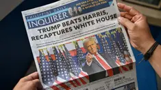 Sebuah foto menunjukkan halaman depan sebuah surat kabar di Manila, Filipina pada tanggal 7 November 2024 yang menunjukkan berita utama tentang terpilihnya kembali Donald Trump sebagai Presiden Amerika Serikat. (JAM STA ROSA/AFP)