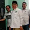 Ketua Umum PKB Muhaimin Iskandar (tengah) tersenyum sebelum menyampaikan keterangan pers di Kantor DPP PKB, Jakarta, Kamis (15/6/2023). (Liputan6.com/Angga Yuniar)