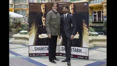Aktor berkebangsaan India, Amitabh Bachchan dan Danush berpose saat acara promosi film terbarunya "Shamitabh" di London, Selasa (27/1/2015). (AFP PHOTO/Justin TALLIS)
