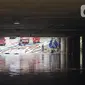 Kondisi banjir yang menggenangi underpass Kemayoran, Jakarta, Senin (3/2/2020). Curah hujan tinggi menyebabkan banjir yang menggenangi kawasan tersebut lama surut sehingga menutup arus lalu lintas. (Liputan6.com/Immanuel Antonius)