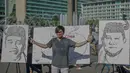 Seorang pria berpose di depan lukisan capres 01 dan 02  yang bertema ‘ Pemilu Penuh Cinta’  saat Car Free day di kawasan Bundaran HI, Jakarta, MInggu (14/4). Kampanye tersebut untuk mengajak masyarakat untuk berpartisipasi dalam Pemilu secara Damai. (Liputan6.com/Faizal Fanani)