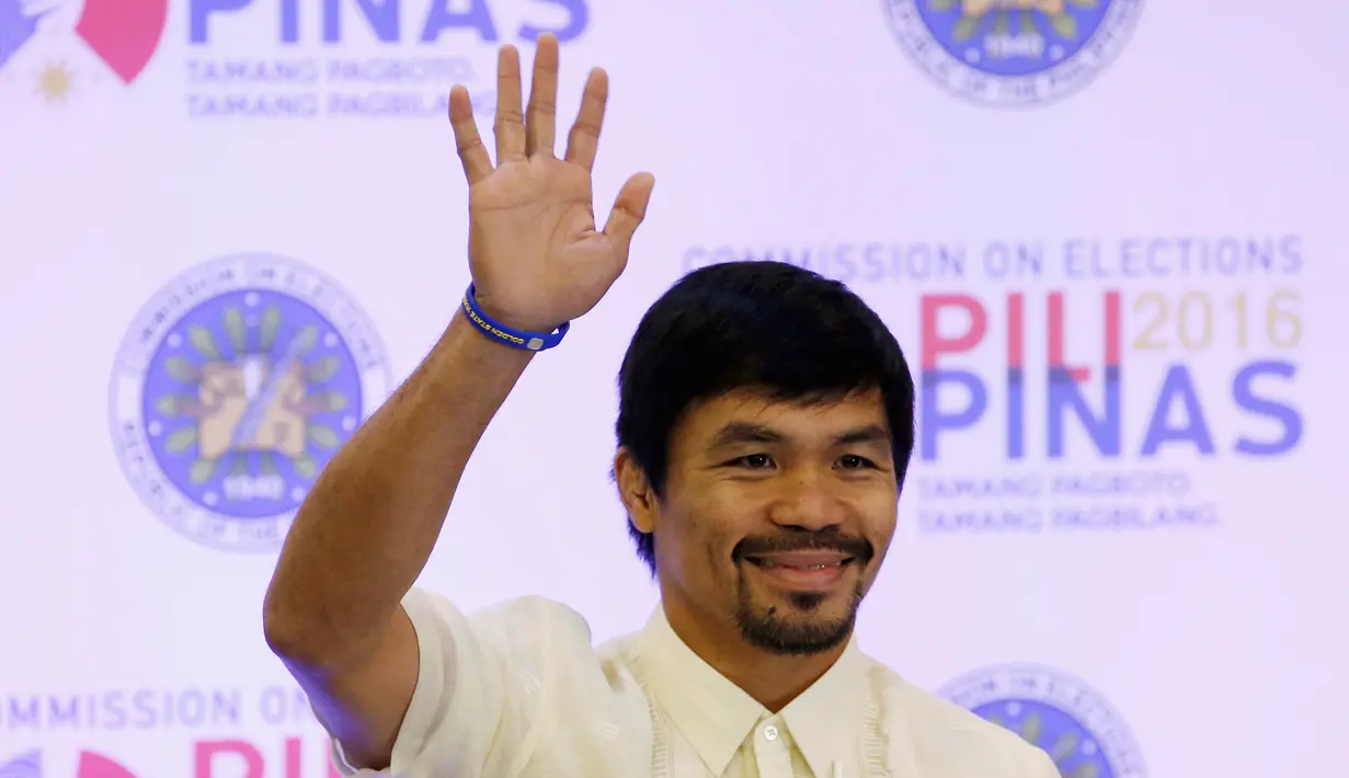 Ekspresi Manny Pacquiao seusai resmi diangkat sebagai senator, di Manila, Filipina, Kamis (19/5). Pacquiao berhasil menduduki 1 dari 12 kursi senator di Majelis Tinggi setelah mendapat 16 juta suara. (REUTERS/Erik De Castro)
