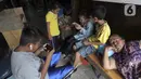 Warga beraktivitas di kawasan Kampung Aquarium saat PSBB, Penjaringan, Jakarta Utara, Kamis (17/9/2020). Kampung Aquarium rencanannya akan dibangun kampung susun yang diperuntukkan bagi warga sekitar. (Liputan6.com/Johan Tallo)