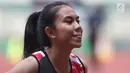 Atlet asal DKI Jakarta, Jeany Nurainy usai menyelesaikan lomba lari 100 meter putri U-20 Kejurnas Atletik U18, U20 dan Senior 2019 di Stadion Pakansari, Kab Bogor, Jumat (2/8/2019). Jeany Nurainy meraih posisi pertama dengan catatan waktu 12,15 detik. (Liputan6.com/Helmi Fithriansyah)