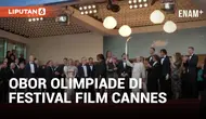 Obor Olimpiade dibawa di karpet merah Festival Film Cannes pada Selasa saat pemutaran perdana film "Marcello Mio" yang dibintangi oleh Catherine Deneuve dan putrinya, Chiara Mastroianni. Paralimpian Prancis Arnaud Assoumani menyalakan obor tersebut s...