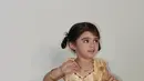 Tak mau kalah, baby Guzel putri dari Margin dan Ali Syakieb pun tampil menawan dengan dress panjang sleeveless India. [‎@marginw]