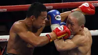 Pertarungan sengit antara Daud Yordan melawan Yoshitaka Kato di atas ring (Johan Tallo/Liputan6.com)