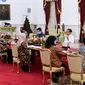 Jokowi menerima tim uji klinis vaksin Covid-19 dari Fakultas Kedokteran Unpad beserta pihak Bio Farma dan Badan Pengawas Obat dan Makanan (BPOM) di Istana Merdeka, Jakarta, Selasa (21/7/2020). (Dok Kementerian Sekretariat Negara)