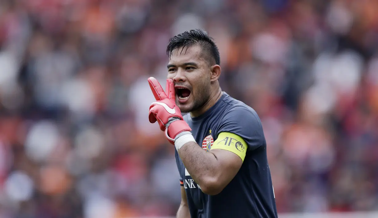 Kiper Persija Jakarta, Andritany Ardhiyasa, saat melawan Ceres-Negros pada laga Piala AFC 2019 di SUGBK, Jakarta, Selasa (23/4). Persija takluk 2-3 dari Ceres-Negros. (Bola.com/M Iqbal Ichsan)