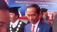 Presiden Jokowi ketika menuju panggung kehormatan. (foto : Liputan6.com/Istiqomah Sheylla/Edhie Prayitno Ige)