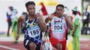 Lalu Mohammad Zohri pelari 100 meter putra asal Nusa Tenggara Barat (kiri) saat beraksi pada PON XX Papua 2021 di Stadion Atletik  Mimika Sport Complex, Kabupaten Mimika, Papua, Rabu (6/10/2021). (Foto: PB PON XX PAPUA 2021/ Ady Sesotya)