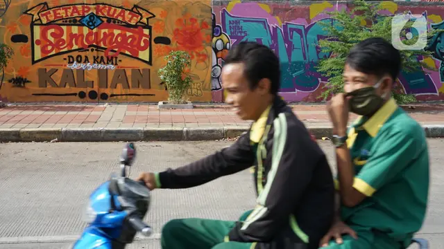 FOTO: Mural Bertema Pandemi COVID-19 Hiasi Tembok di Sunter