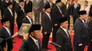 Menteri Koordinator Bidang Politik dan Keamanan Indonesia, Budi Gunawan saat diambil sumpah jabatan dalam upacara pelantikan menteri-menteri baru di istana kepresidenan di Jakarta, (AP Photo/Achmad Ibrahim)