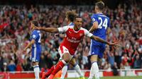 Striker Arsenal Theo Walcott merayakan gol ke gawang Chelsea pada laga Premier League di Emirates Stadium, London, Sabtu (24/9/2016). (AFP/Ian Kington)