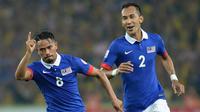 Safiq Rahim (kiri), pemain bintang yang absen di Piala AFF 2016 karena memilih pensiun dini dari timnas Malaysia. (AFP/Mohd Rasfan)