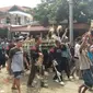 Suasana rebutan jembul (rambut) sebagai manifestasi rambut Ratu Kalinyamat. (foto : Liputan6.com/edhie prayitno ige)