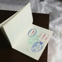 Ilustrasi visa dan paspor. (dok.  Global Residence Index/Unsplash)