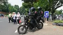 Personel polisi Korps Brigade Mobil berpatroli dengan sepeda motor pada hari terakhir kampanye di Jakarta pada tanggal 10 Februari 2014. (ADEK BERRY/AFP)