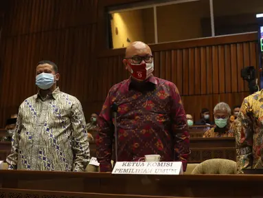 Mendagri Tito Karnavian (kanan), bersama Plt Ketua KPU Ilham Saputra (tengah) dan Ketua Bawaslu Abhan menghadiri rapat dengar pendapat dengan Komisi II di gedung DPR RI, Jakarta, Selasa (19/1/2021). Rapat membahas evaluasi pelaksanaan Pilkada 2020. (Liputan6.com/Angga Yuniar)