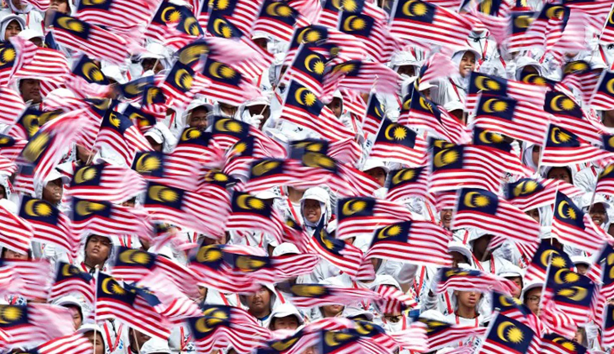 Malaysia merupakan salah satu negara yang menjalankan tradisi mudik menjelang Idul Fitri. Istilah 'mudik' biasa disebut warga Malaysia sebagai 'Balik Kampung'. (AFP PHOTO/ Manan VATSYAYANA)