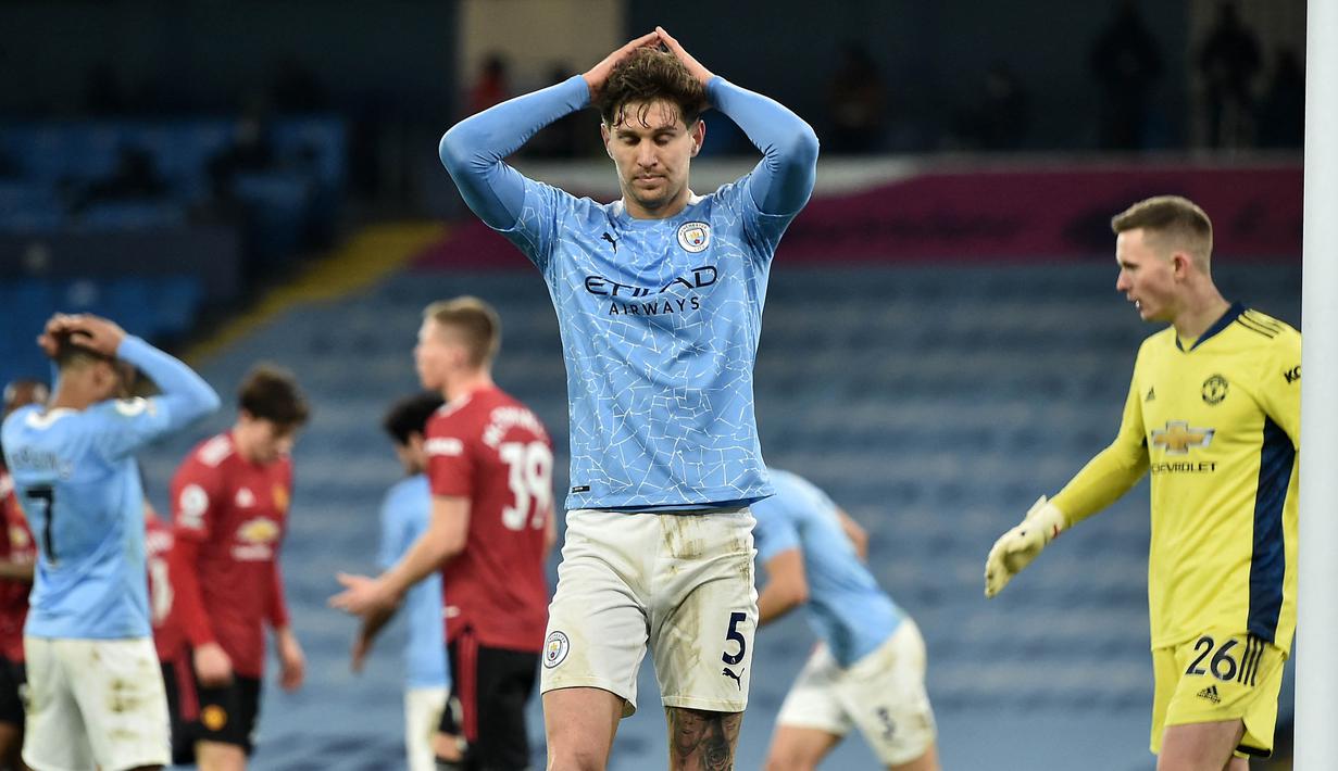 Menjadi salah satu bek terbaik di Liga Inggris musim lalu, John Stones belum pernah dimainkan oleh Pep Guardiola di ajang apapun. Padahal Stones dipercaya Gareth Bale di perhelatan Piala Eropa 2020 dan membawa Inggris hingga putaran final. (AFP/Pool/Peter Powell)