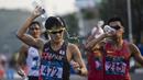 Pejalan cepat Jepang, Satoshi Maruo, saat menyelesaikan lomba nomor jalan cepat 50 kilometer cabang atletik Asian Games XVIII di Senayan, Jakarta, Kamis (29/8/2018). Dirinya finish posisi keempat. (Bola.com/Vitalis Yogi Trisna)